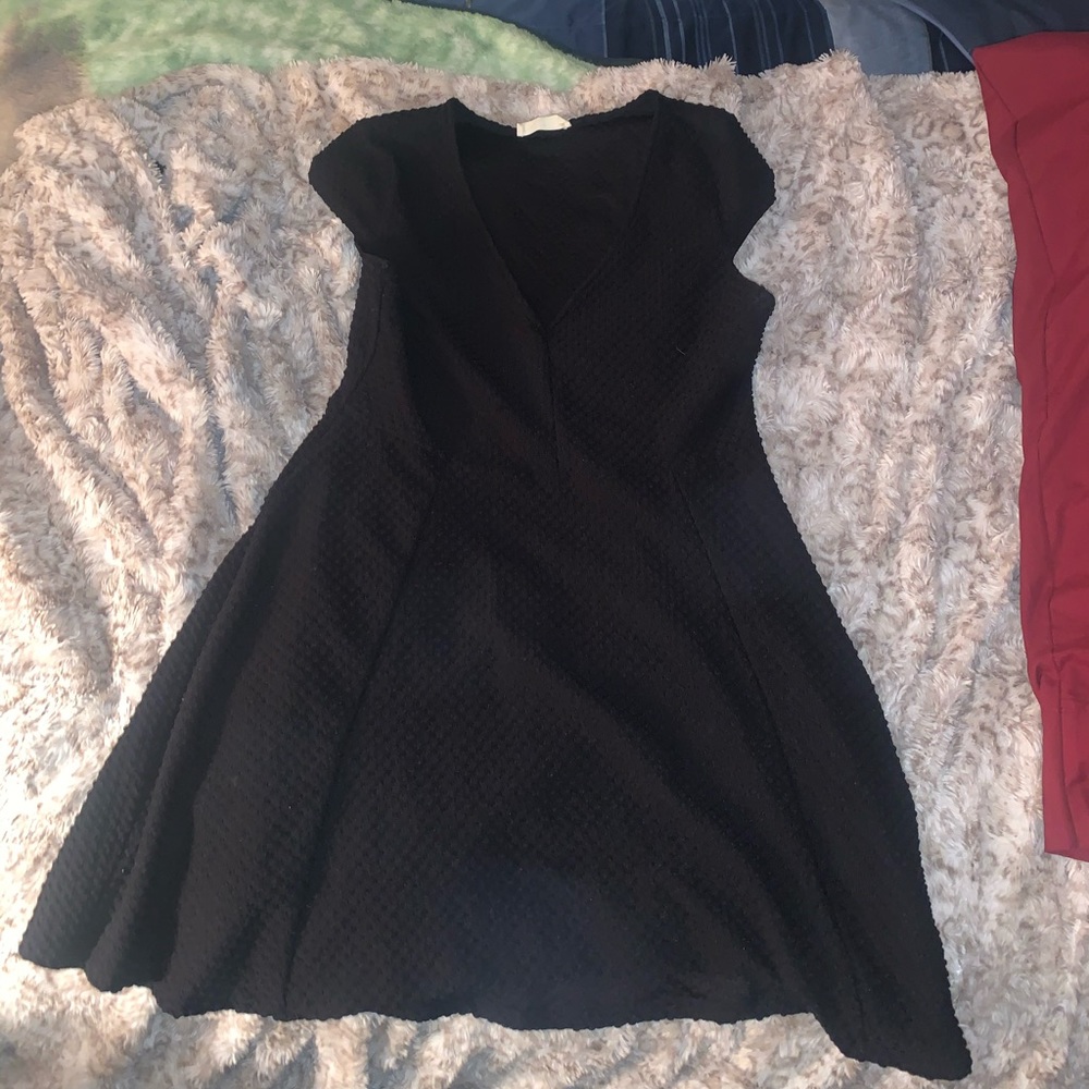 A vintage black dress with a deep v line.